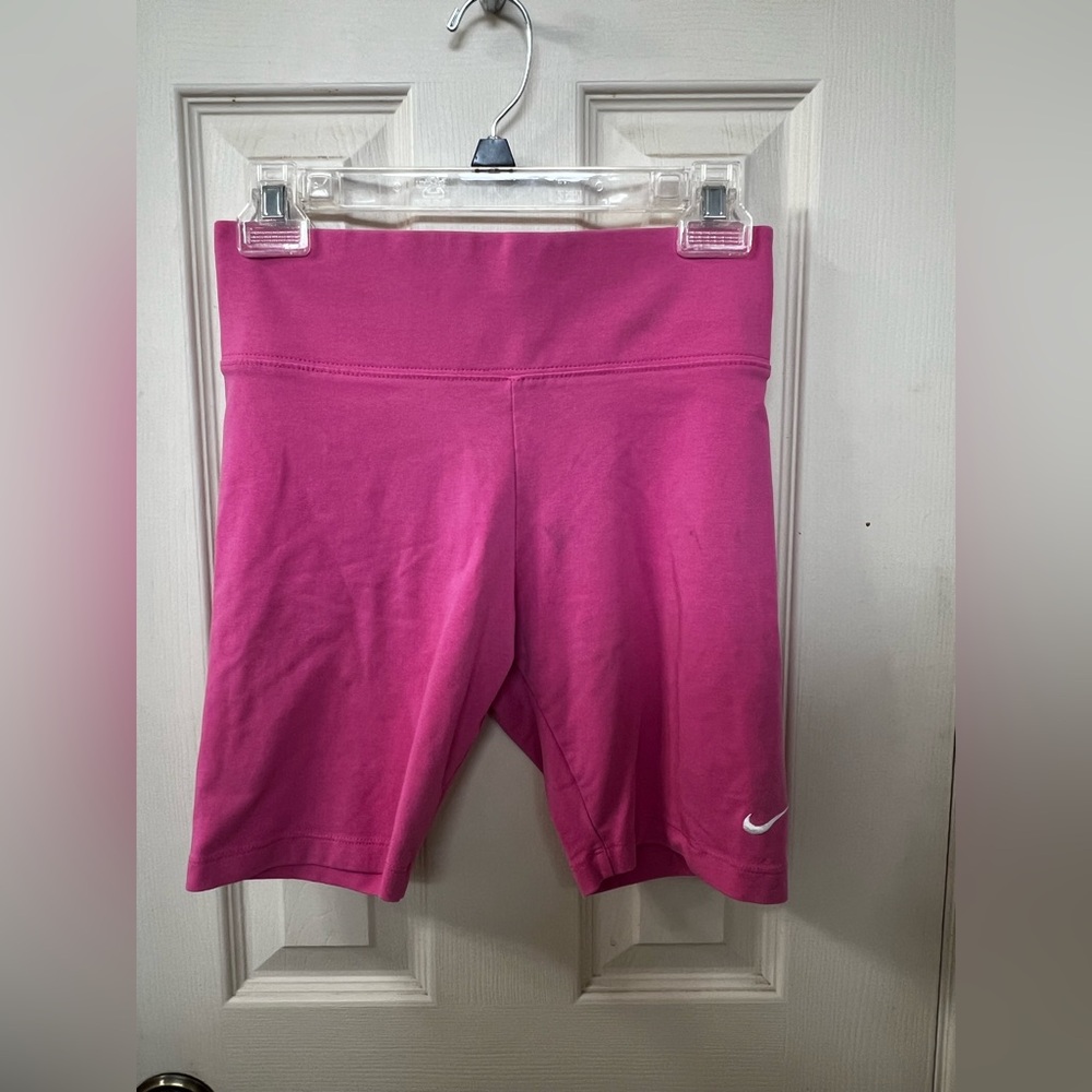 Hot pink Nike 7” biker shorts.